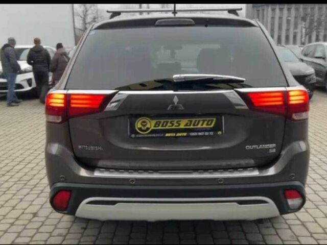 Серый Мицубиси Аутлендер, объемом двигателя 2.4 л и пробегом 160 тыс. км за 14900 $, фото 4 на Automoto.ua