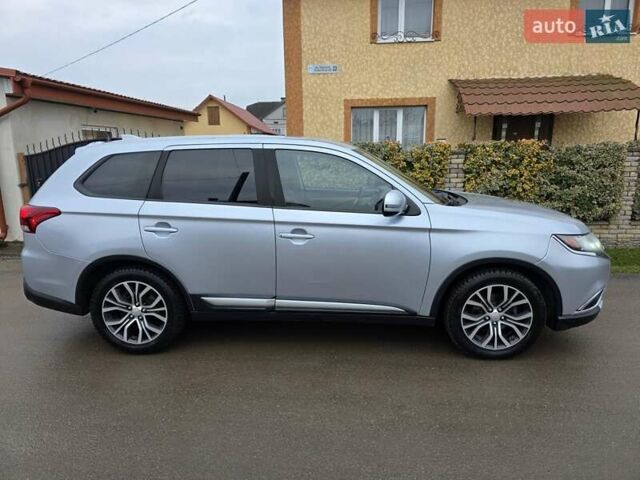 Серый Мицубиси Аутлендер, объемом двигателя 2.36 л и пробегом 170 тыс. км за 13800 $, фото 12 на Automoto.ua