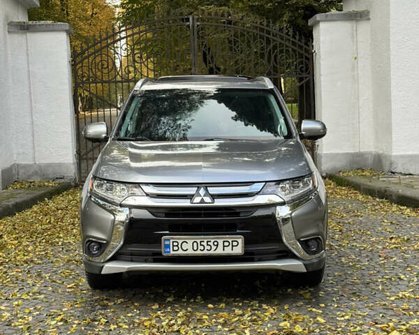 Серый Мицубиси Аутлендер, объемом двигателя 3 л и пробегом 159 тыс. км за 19500 $, фото 1 на Automoto.ua