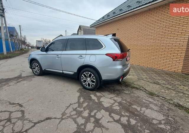 Серый Мицубиси Аутлендер, объемом двигателя 2.36 л и пробегом 120 тыс. км за 16100 $, фото 3 на Automoto.ua