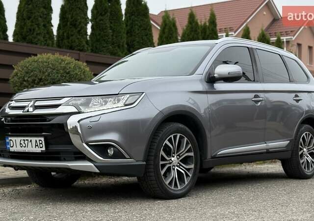 Серый Мицубиси Аутлендер, объемом двигателя 2.36 л и пробегом 153 тыс. км за 16950 $, фото 1 на Automoto.ua