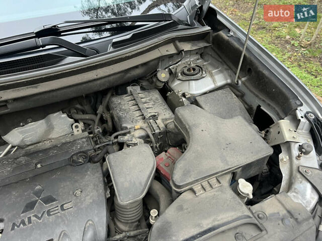 Серый Мицубиси Аутлендер, объемом двигателя 2.4 л и пробегом 189 тыс. км за 16950 $, фото 142 на Automoto.ua