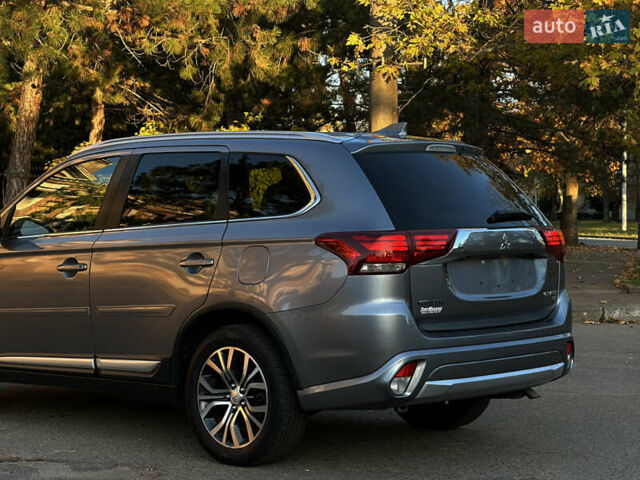Серый Мицубиси Аутлендер, объемом двигателя 2.4 л и пробегом 167 тыс. км за 15999 $, фото 4 на Automoto.ua