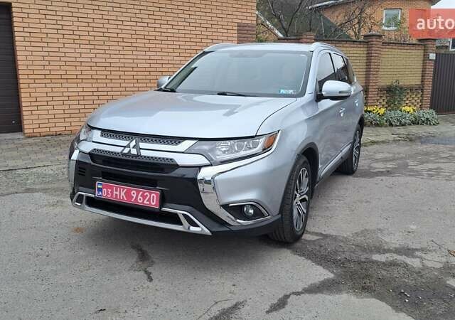 Серый Мицубиси Аутлендер, объемом двигателя 2.36 л и пробегом 120 тыс. км за 16100 $, фото 1 на Automoto.ua