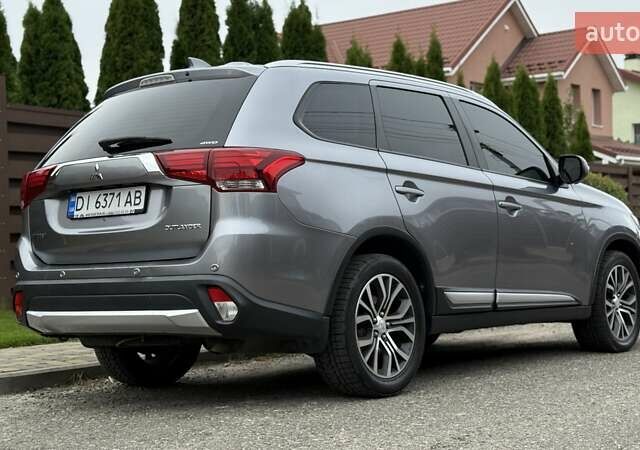 Серый Мицубиси Аутлендер, объемом двигателя 2.36 л и пробегом 153 тыс. км за 16950 $, фото 2 на Automoto.ua