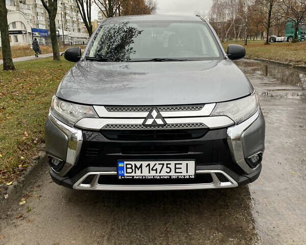 Серый Мицубиси Аутлендер, объемом двигателя 2.36 л и пробегом 150 тыс. км за 13500 $, фото 1 на Automoto.ua