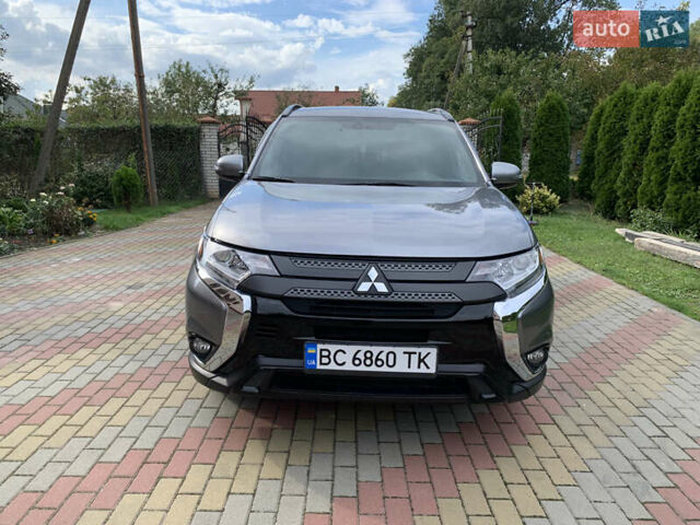 Сірий Міцубісі Аутлендер, об'ємом двигуна 2.38 л та пробігом 130 тис. км за 15000 $, фото 2 на Automoto.ua