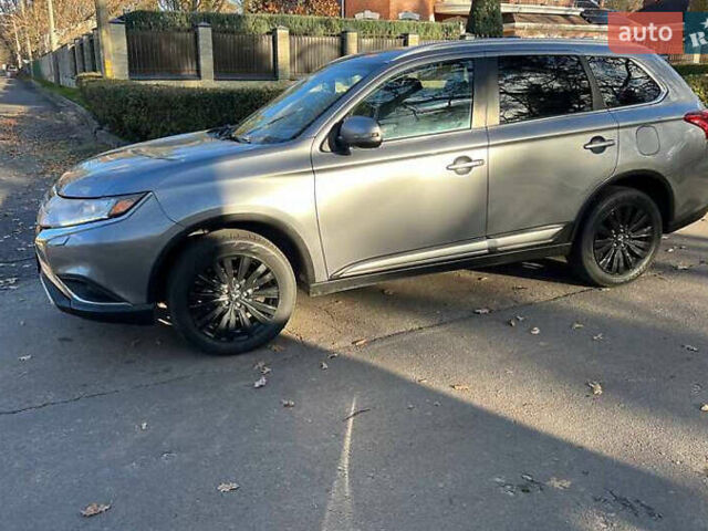 Серый Мицубиси Аутлендер, объемом двигателя 2.4 л и пробегом 120 тыс. км за 23200 $, фото 1 на Automoto.ua