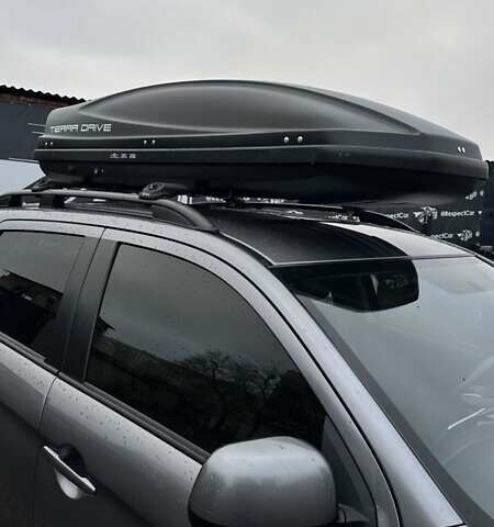 Серый Мицубиси Аутлендер, объемом двигателя 2 л и пробегом 70 тыс. км за 16899 $, фото 1 на Automoto.ua