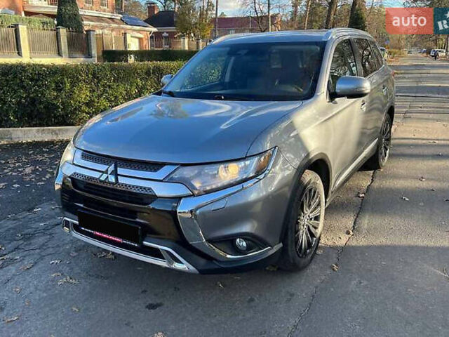 Серый Мицубиси Аутлендер, объемом двигателя 2.4 л и пробегом 120 тыс. км за 23200 $, фото 2 на Automoto.ua