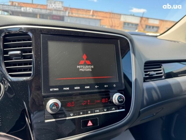 Серый Мицубиси Аутлендер, объемом двигателя 2 л и пробегом 58 тыс. км за 21790 $, фото 23 на Automoto.ua