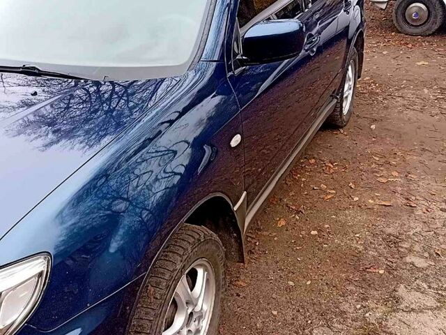 Синий Мицубиси Аутлендер, объемом двигателя 2 л и пробегом 195 тыс. км за 6500 $, фото 7 на Automoto.ua