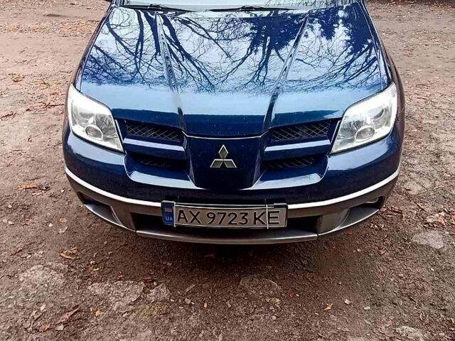 Синий Мицубиси Аутлендер, объемом двигателя 2 л и пробегом 195 тыс. км за 6500 $, фото 4 на Automoto.ua