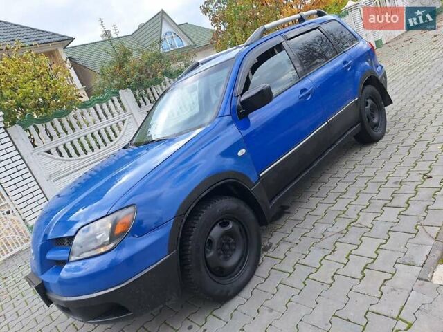 Синій Міцубісі Аутлендер, об'ємом двигуна 2.4 л та пробігом 234 тис. км за 4100 $, фото 17 на Automoto.ua