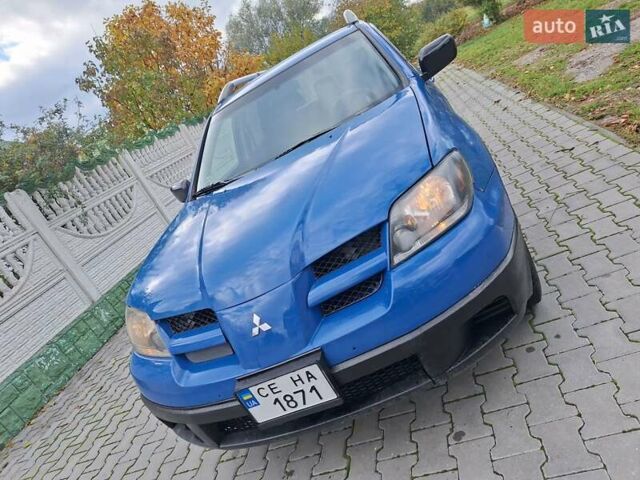 Синій Міцубісі Аутлендер, об'ємом двигуна 2.4 л та пробігом 234 тис. км за 4100 $, фото 15 на Automoto.ua