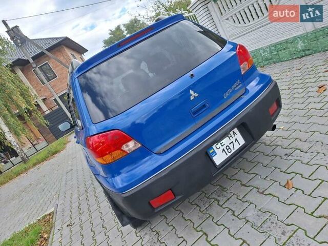 Синій Міцубісі Аутлендер, об'ємом двигуна 2.4 л та пробігом 234 тис. км за 4300 $, фото 4 на Automoto.ua