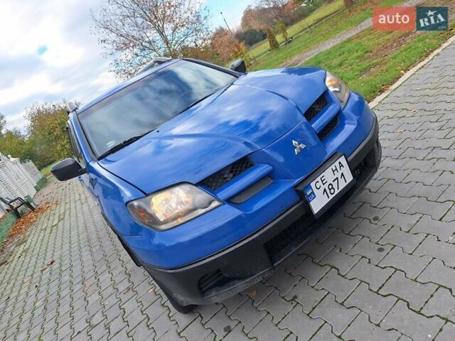 Синій Міцубісі Аутлендер, об'ємом двигуна 2.4 л та пробігом 234 тис. км за 4100 $, фото 12 на Automoto.ua