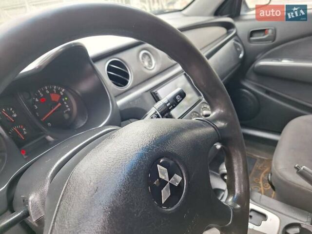 Синій Міцубісі Аутлендер, об'ємом двигуна 2.4 л та пробігом 234 тис. км за 4100 $, фото 34 на Automoto.ua