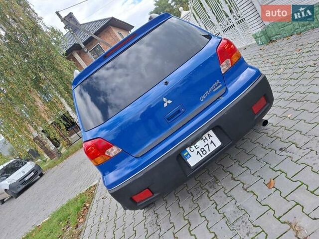 Синій Міцубісі Аутлендер, об'ємом двигуна 2.4 л та пробігом 234 тис. км за 4100 $, фото 5 на Automoto.ua