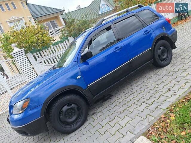 Синій Міцубісі Аутлендер, об'ємом двигуна 2.4 л та пробігом 234 тис. км за 4300 $, фото 19 на Automoto.ua
