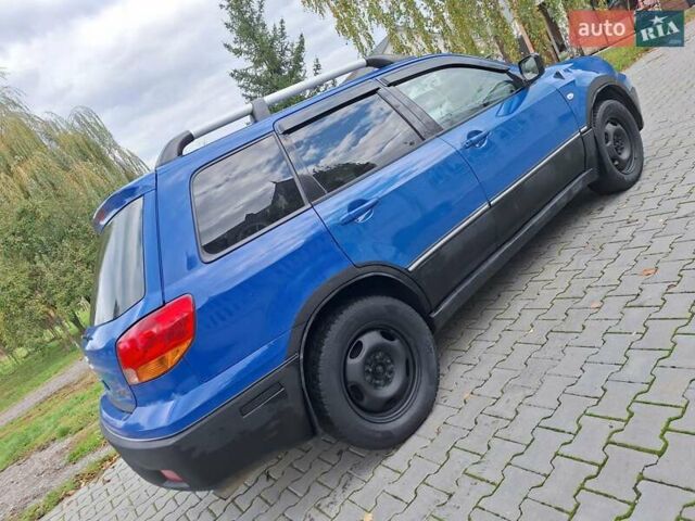 Синій Міцубісі Аутлендер, об'ємом двигуна 2.4 л та пробігом 234 тис. км за 4300 $, фото 10 на Automoto.ua