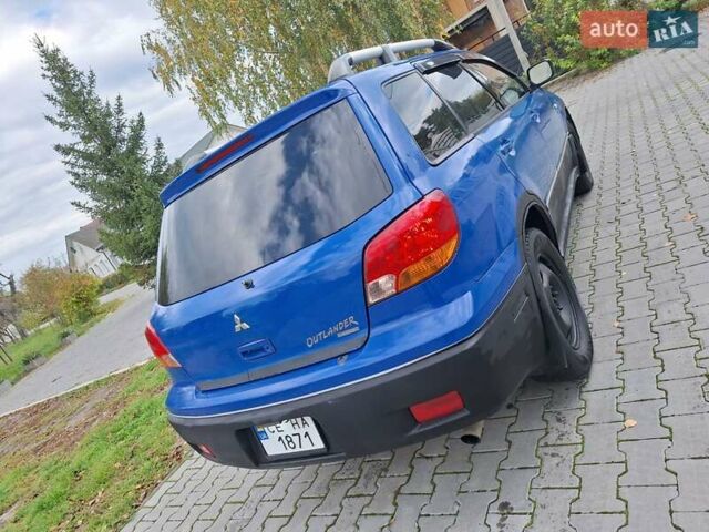 Синій Міцубісі Аутлендер, об'ємом двигуна 2.4 л та пробігом 234 тис. км за 4100 $, фото 6 на Automoto.ua