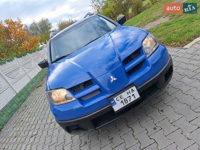 Синій Міцубісі Аутлендер, об'ємом двигуна 2.4 л та пробігом 234 тис. км за 4100 $, фото 14 на Automoto.ua