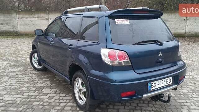 Синий Мицубиси Аутлендер, объемом двигателя 2 л и пробегом 400 тыс. км за 4400 $, фото 9 на Automoto.ua