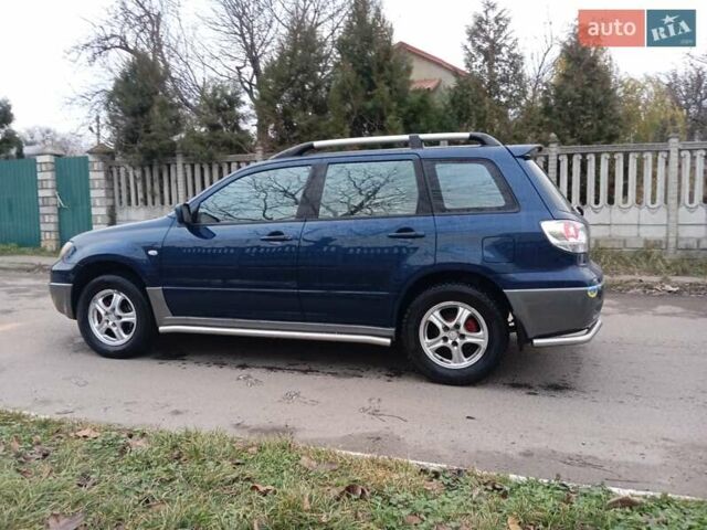 Синий Мицубиси Аутлендер, объемом двигателя 2.38 л и пробегом 175 тыс. км за 6500 $, фото 6 на Automoto.ua