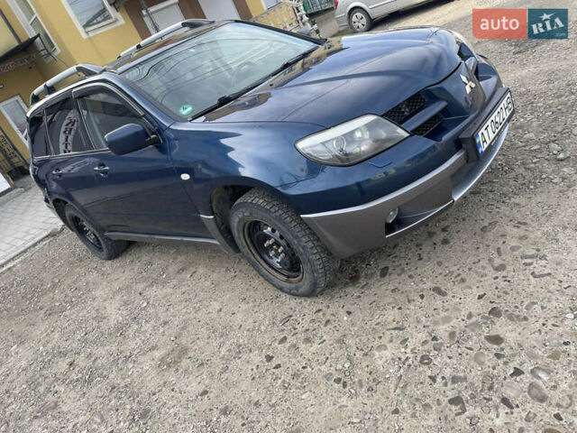Синий Мицубиси Аутлендер, объемом двигателя 2 л и пробегом 231 тыс. км за 4900 $, фото 2 на Automoto.ua
