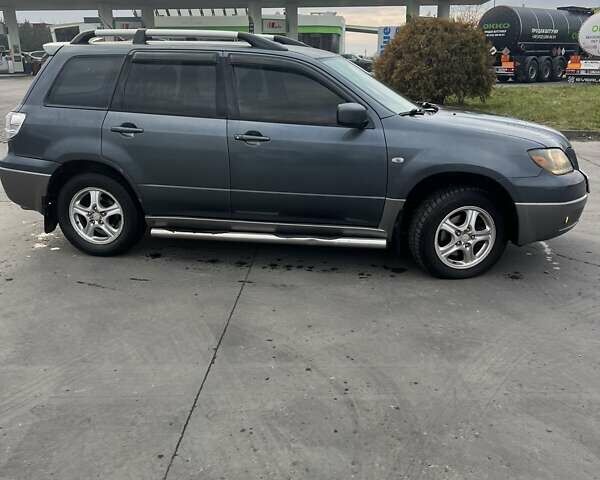 Синий Мицубиси Аутлендер, объемом двигателя 2.38 л и пробегом 300 тыс. км за 4200 $, фото 6 на Automoto.ua