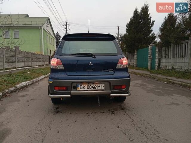 Синий Мицубиси Аутлендер, объемом двигателя 2.38 л и пробегом 175 тыс. км за 6500 $, фото 5 на Automoto.ua