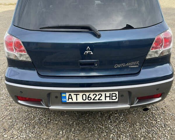 Синий Мицубиси Аутлендер, объемом двигателя 2 л и пробегом 231 тыс. км за 4900 $, фото 4 на Automoto.ua