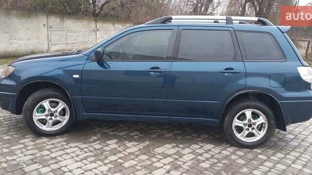 Синий Мицубиси Аутлендер, объемом двигателя 2 л и пробегом 400 тыс. км за 4400 $, фото 8 на Automoto.ua