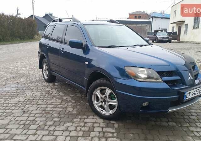 Синий Мицубиси Аутлендер, объемом двигателя 2 л и пробегом 400 тыс. км за 4400 $, фото 13 на Automoto.ua