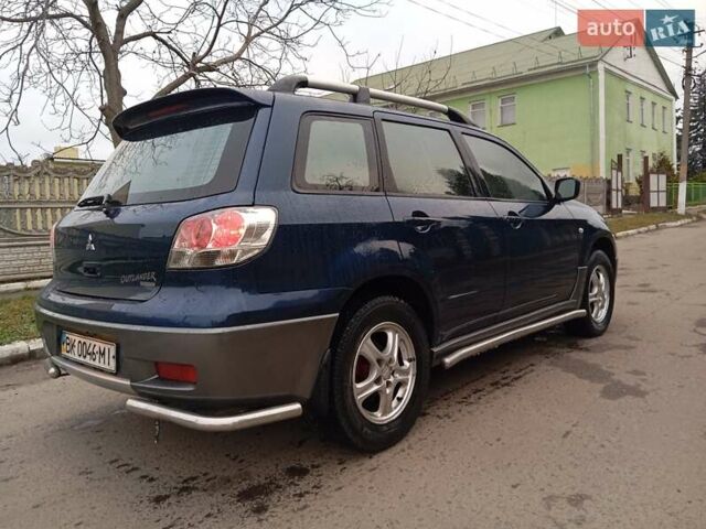 Синий Мицубиси Аутлендер, объемом двигателя 2.38 л и пробегом 175 тыс. км за 6500 $, фото 3 на Automoto.ua