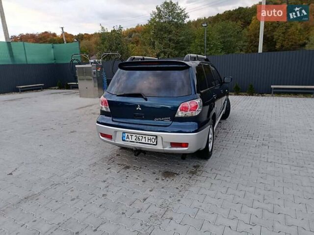 Синий Мицубиси Аутлендер, объемом двигателя 2.38 л и пробегом 250 тыс. км за 6350 $, фото 7 на Automoto.ua