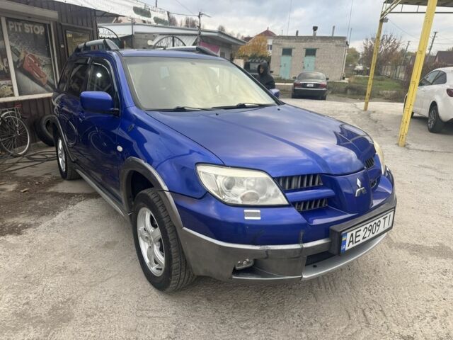 Синій Міцубісі Аутлендер, об'ємом двигуна 2.4 л та пробігом 220 тис. км за 4500 $, фото 1 на Automoto.ua