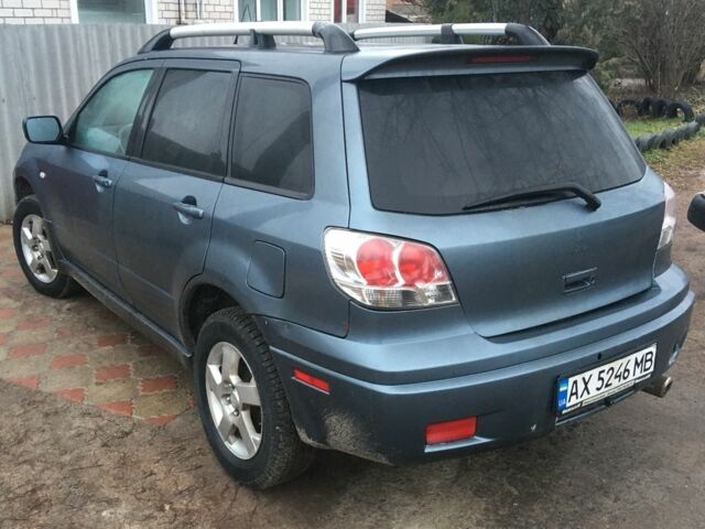 Синий Мицубиси Аутлендер, объемом двигателя 2.4 л и пробегом 218 тыс. км за 3500 $, фото 1 на Automoto.ua