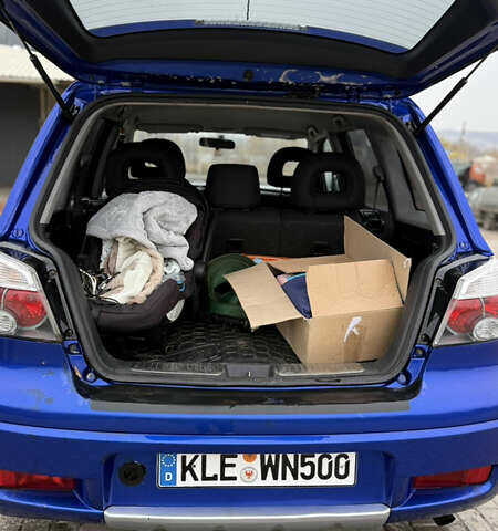 Синий Мицубиси Аутлендер, объемом двигателя 2.4 л и пробегом 243 тыс. км за 5000 $, фото 8 на Automoto.ua