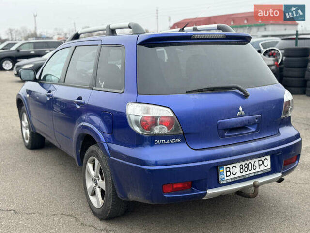 Синий Мицубиси Аутлендер, объемом двигателя 2.4 л и пробегом 245 тыс. км за 4600 $, фото 3 на Automoto.ua