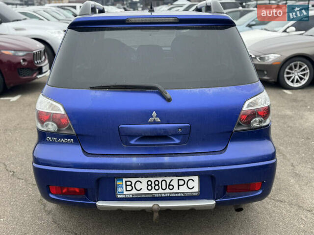 Синий Мицубиси Аутлендер, объемом двигателя 2.4 л и пробегом 245 тыс. км за 4600 $, фото 4 на Automoto.ua