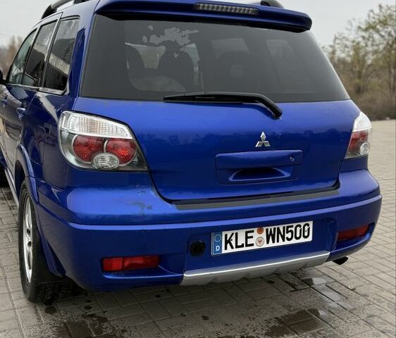 Синий Мицубиси Аутлендер, объемом двигателя 2.4 л и пробегом 243 тыс. км за 5000 $, фото 15 на Automoto.ua