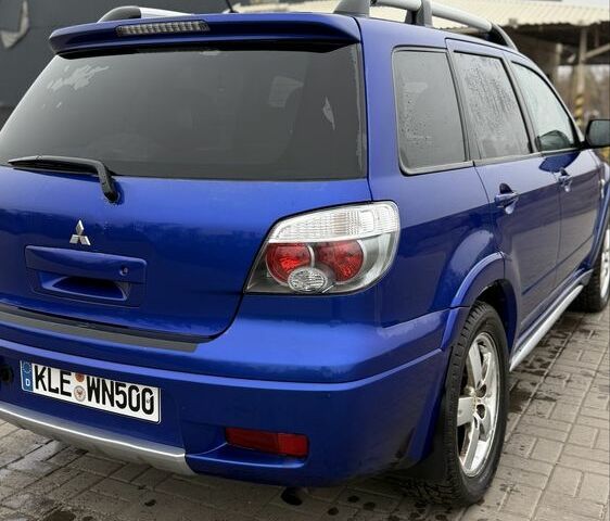 Синий Мицубиси Аутлендер, объемом двигателя 2.4 л и пробегом 243 тыс. км за 5000 $, фото 16 на Automoto.ua