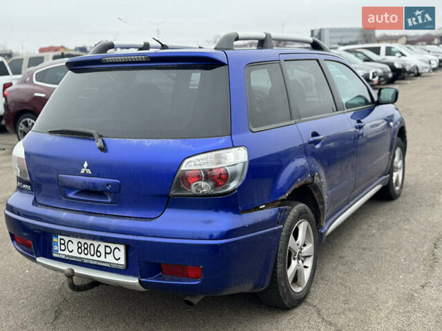 Синий Мицубиси Аутлендер, объемом двигателя 2.4 л и пробегом 245 тыс. км за 4600 $, фото 5 на Automoto.ua