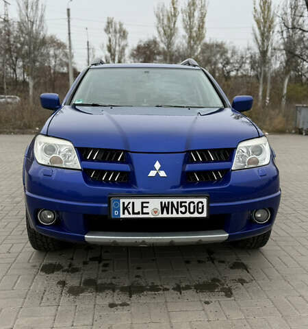 Синий Мицубиси Аутлендер, объемом двигателя 2.4 л и пробегом 243 тыс. км за 5000 $, фото 4 на Automoto.ua