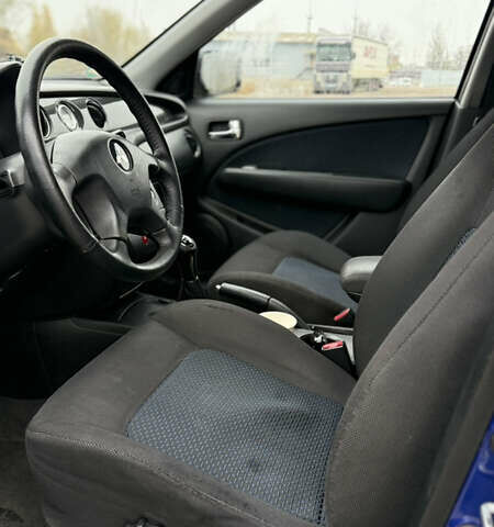 Синий Мицубиси Аутлендер, объемом двигателя 2.4 л и пробегом 243 тыс. км за 5000 $, фото 11 на Automoto.ua