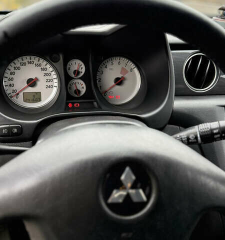 Синий Мицубиси Аутлендер, объемом двигателя 2.4 л и пробегом 243 тыс. км за 5000 $, фото 10 на Automoto.ua