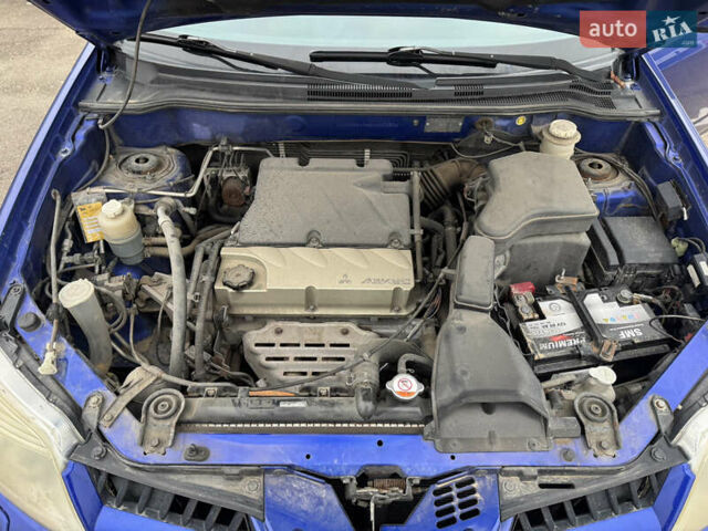 Синий Мицубиси Аутлендер, объемом двигателя 2.4 л и пробегом 245 тыс. км за 4600 $, фото 13 на Automoto.ua