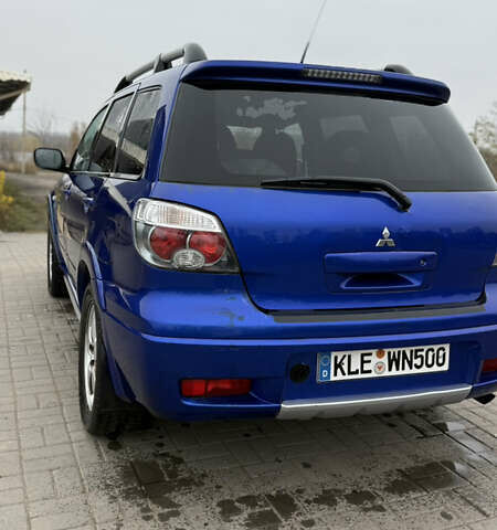 Синий Мицубиси Аутлендер, объемом двигателя 2.4 л и пробегом 243 тыс. км за 5000 $, фото 14 на Automoto.ua